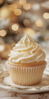 a cupcake on a plate with a christmas tree in the background