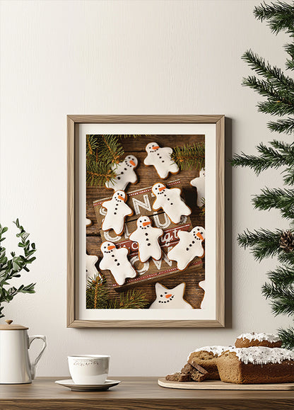 a framed picture of ginger cookies on a table