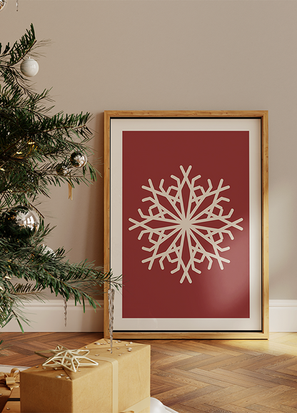 a picture of a snowflake in a frame next to a christmas tree