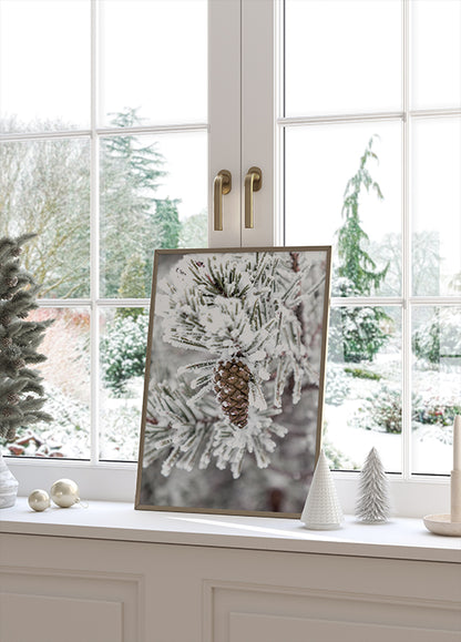 a picture of a pine cone on a window sill