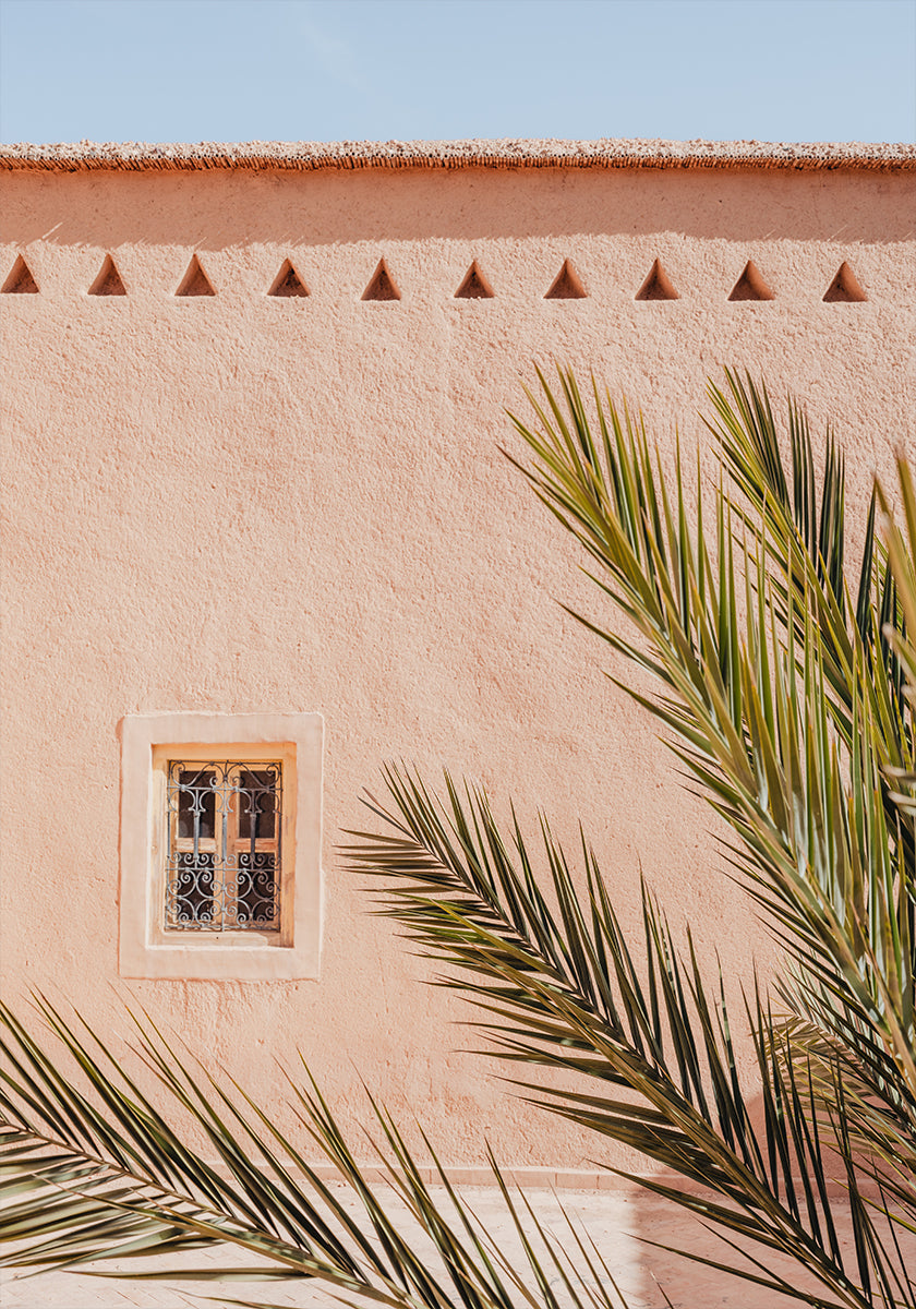 Palm leaves and a clay building in Morocco Poster