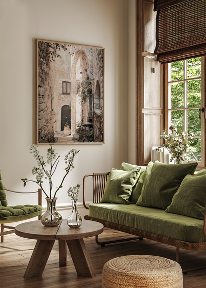 a living room filled with furniture and a painting on the wall