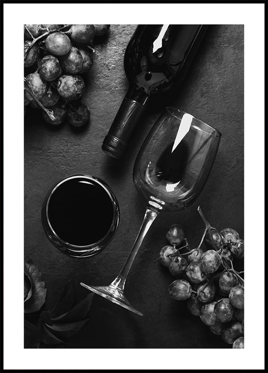 a black and white photo of a glass of wine