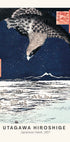 a bird flying over a body of water