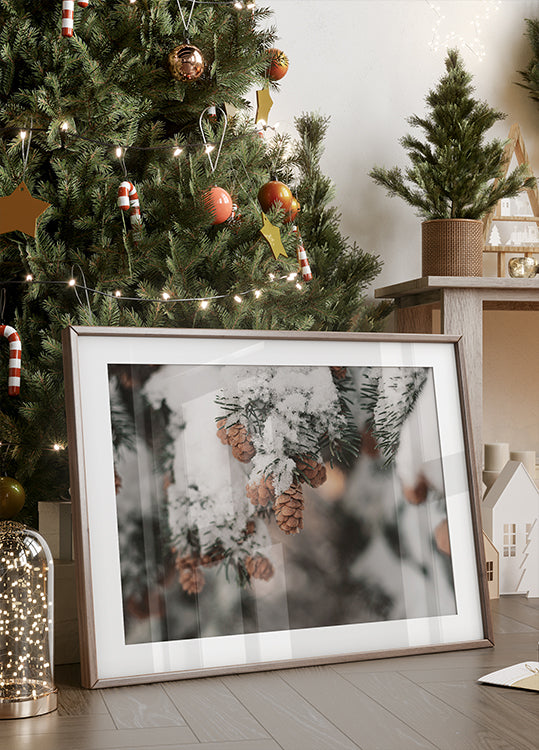 Snow-Covered Branch with Pine Cones Poster