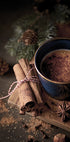 a cup of hot chocolate on a cutting board