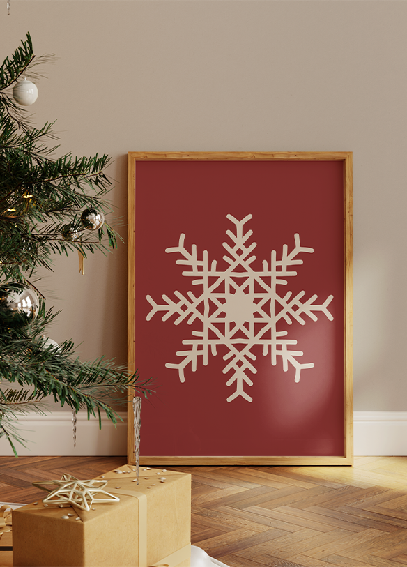 a picture of a snowflake on a wall next to a christmas tree