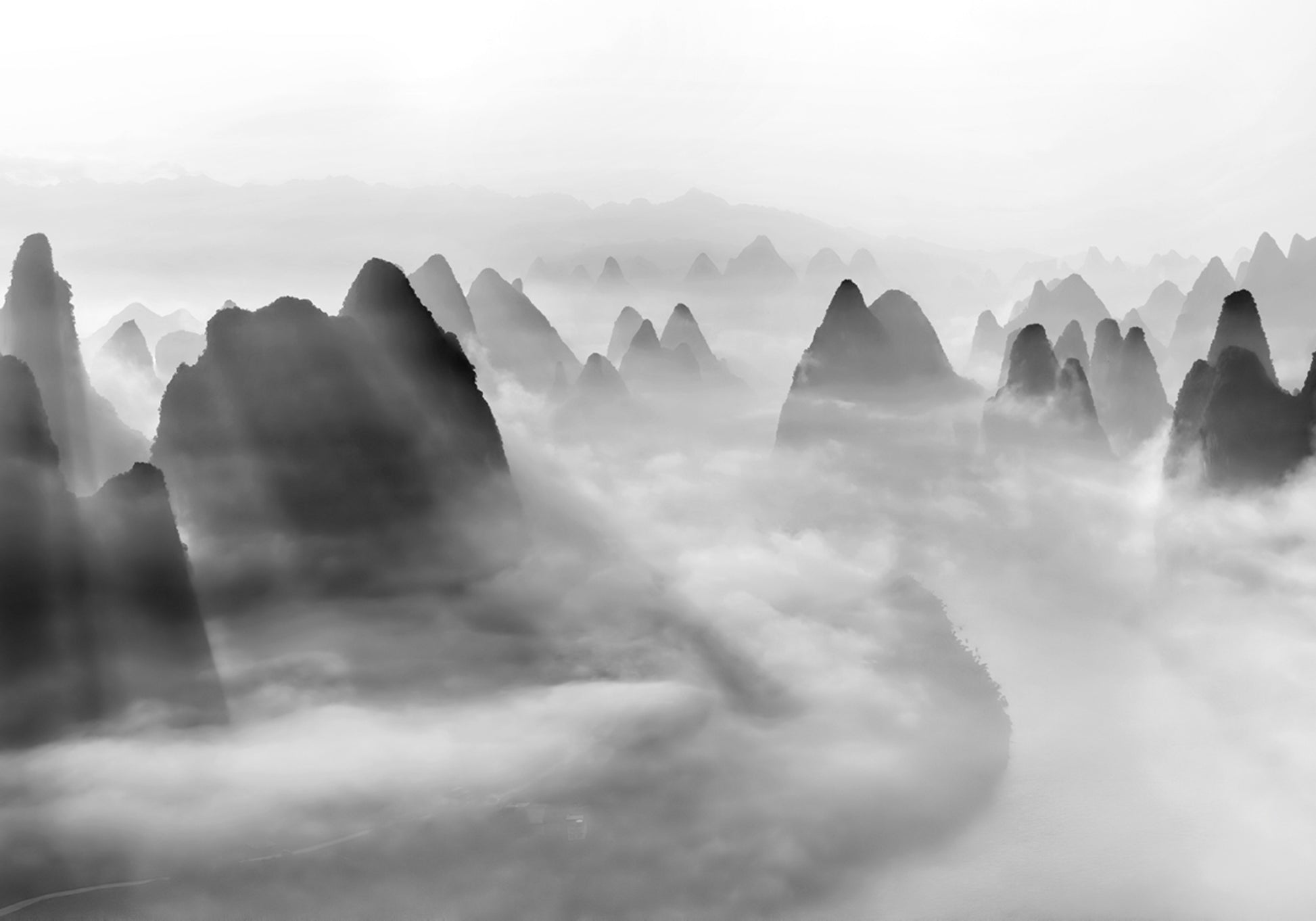Light Rays Over Misty Peaks