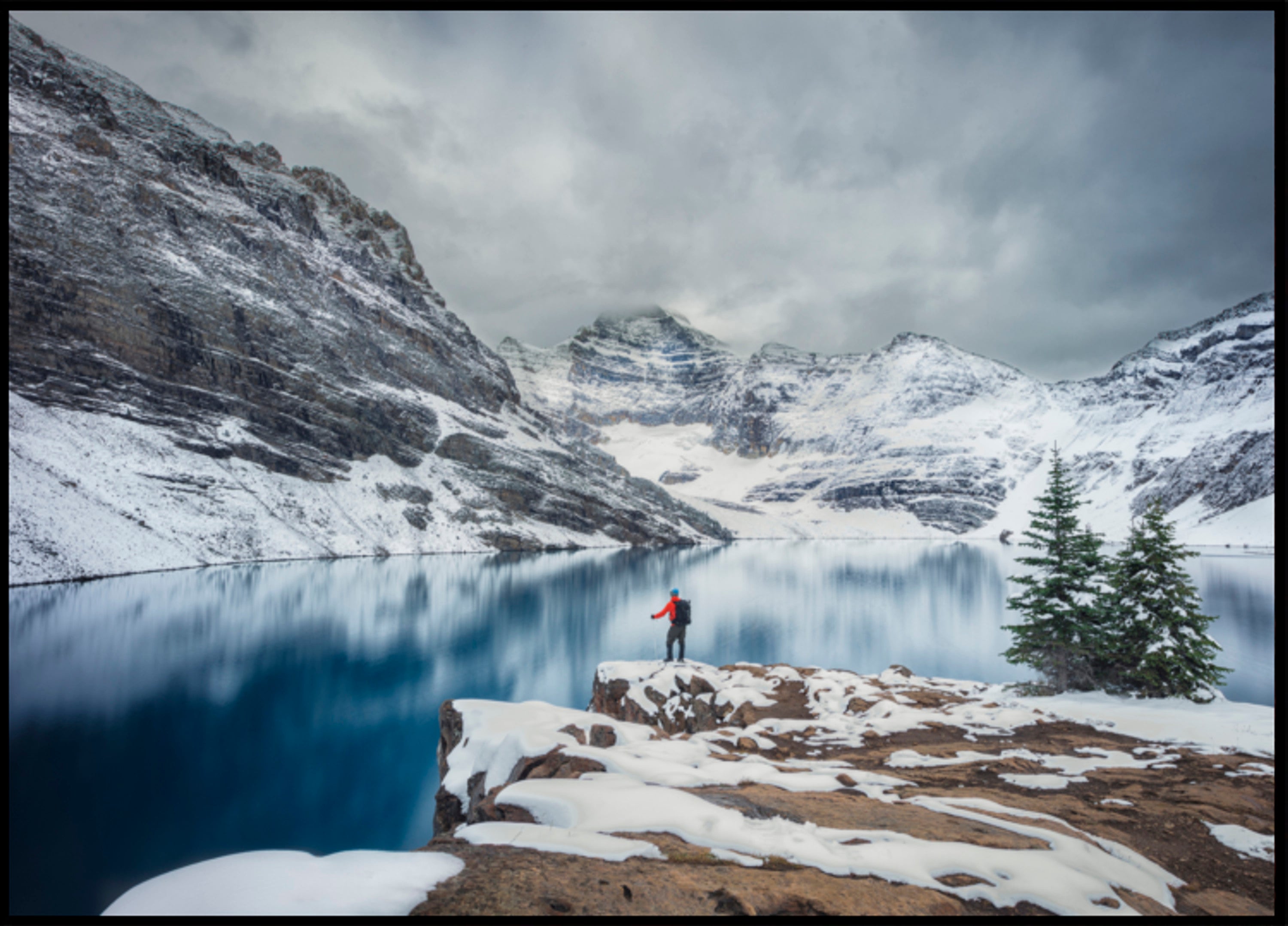 Hiker At Snowy Lake